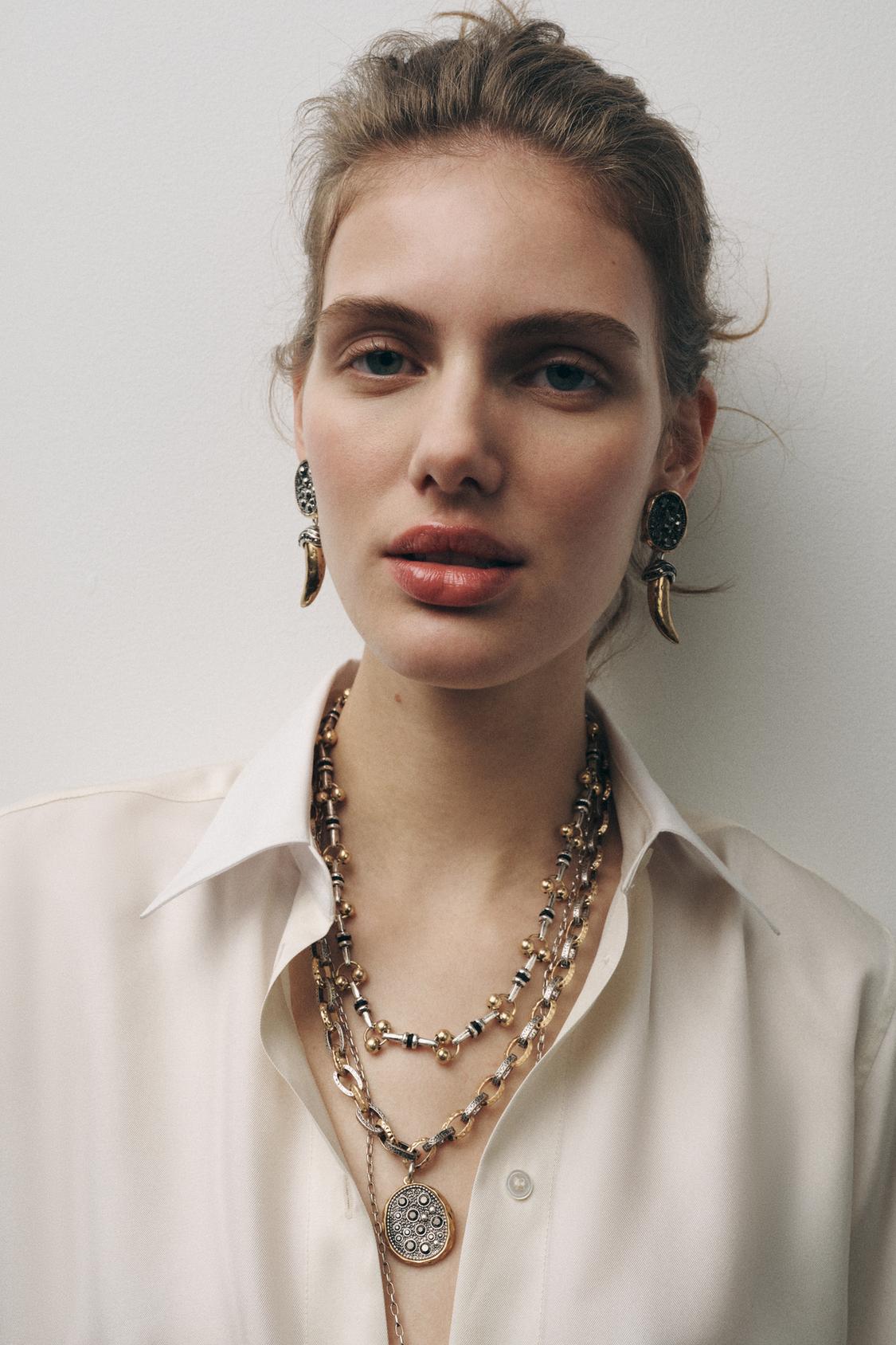 SPARKLY HORN EARRINGS