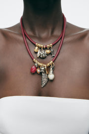 PACK OF 2 CORD NECKLACES WITH CHARMS