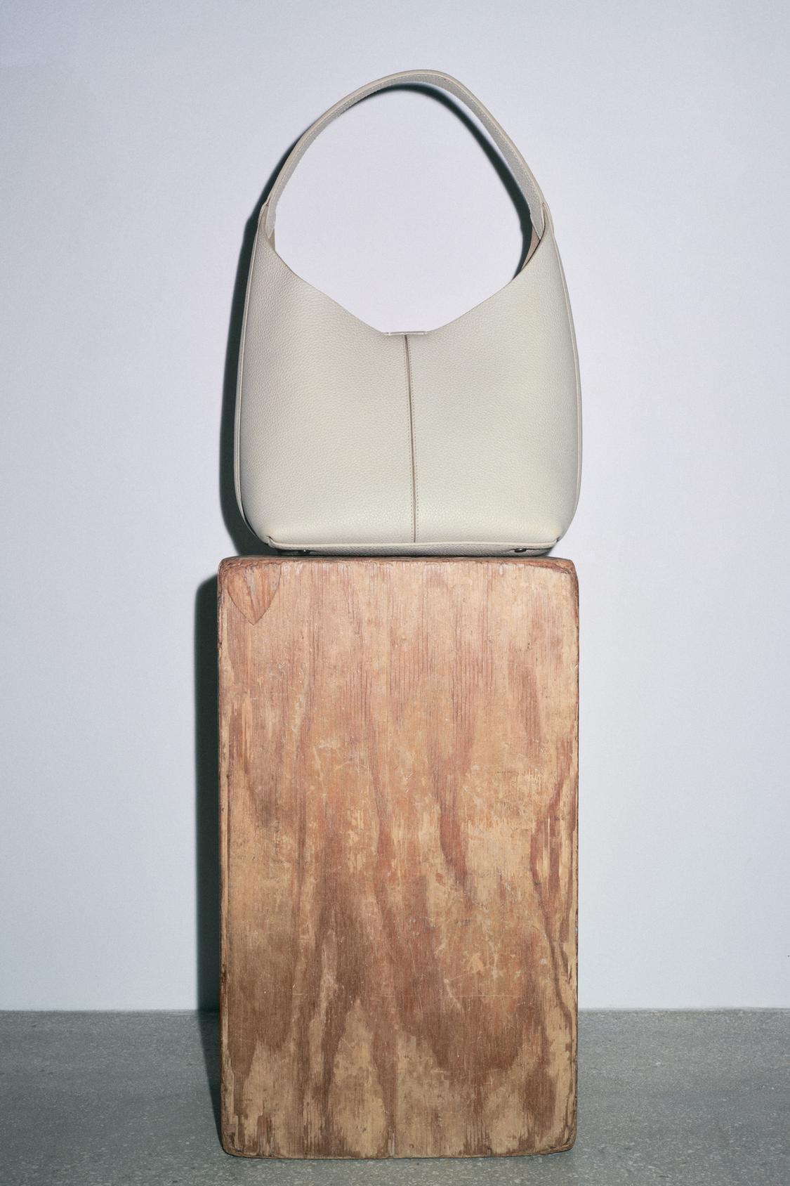 GRAINED EFFECT LEATHER BUCKET BAG
